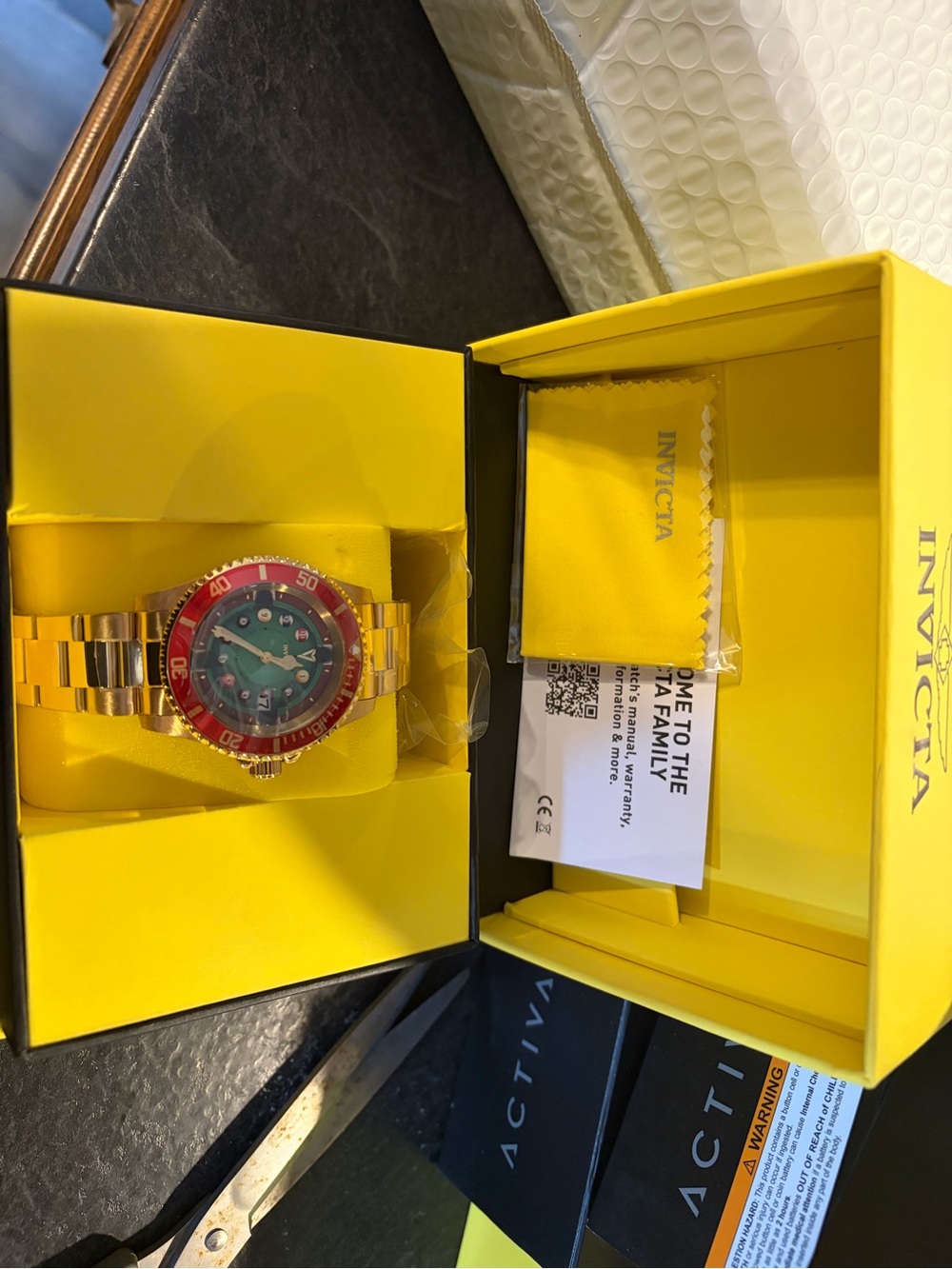 Invicta Gold Tone Men's Watch with Red Bezel and Green Dial